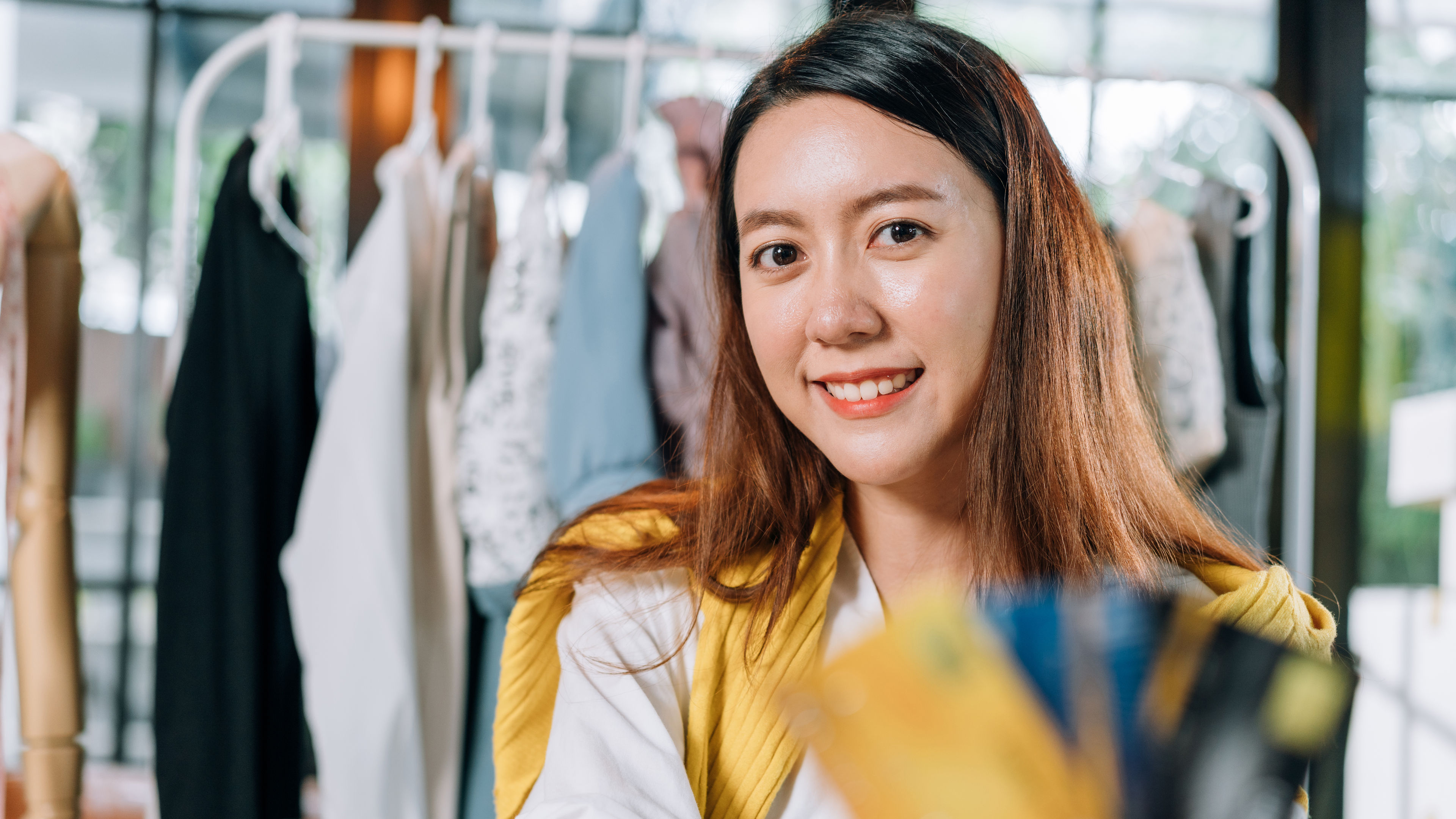 Asian woman showing credit card for online shopping