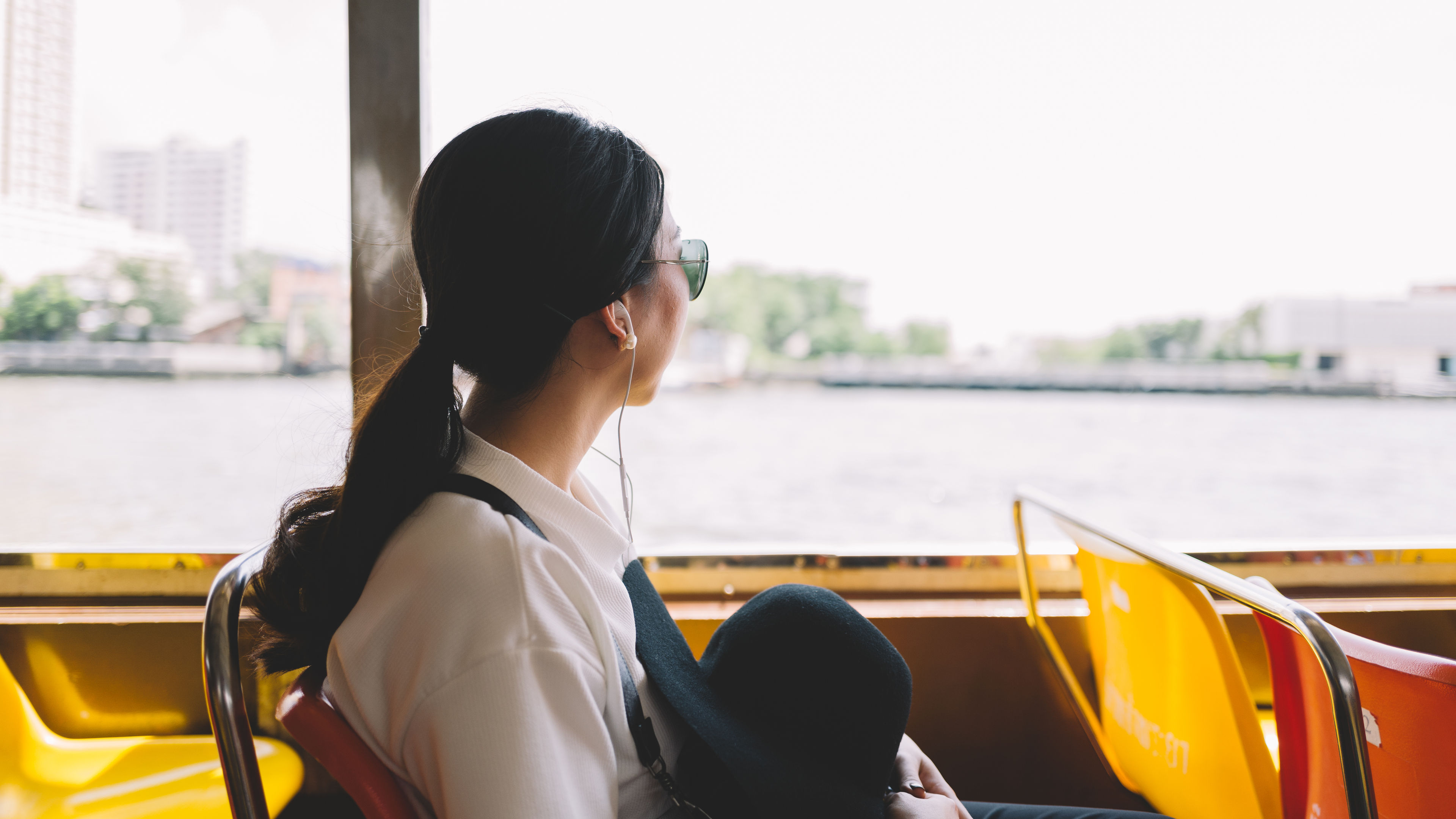 A woman sits on a boat