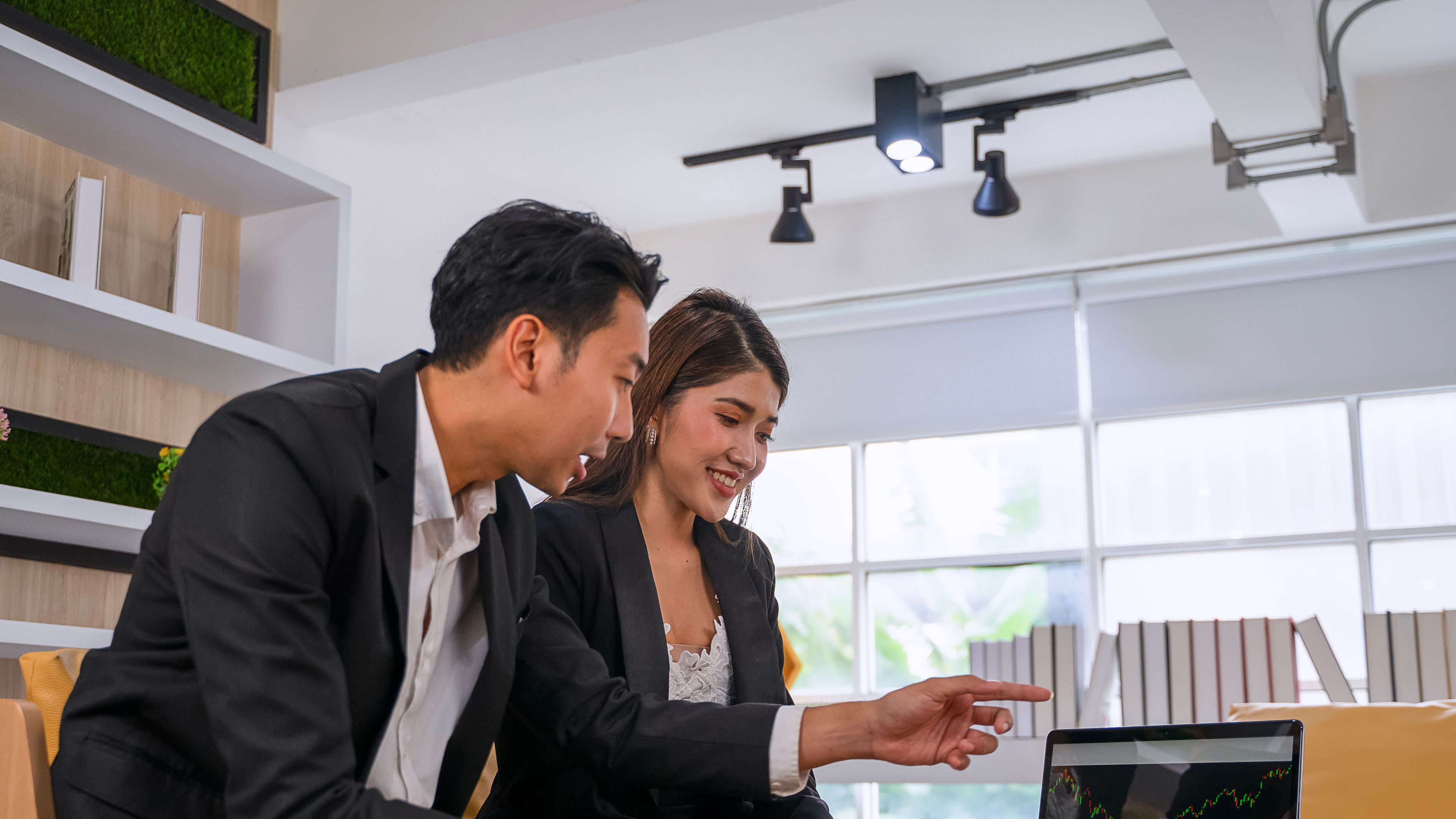 Asian Business Professionals Engaged in a Meeting at the Office.