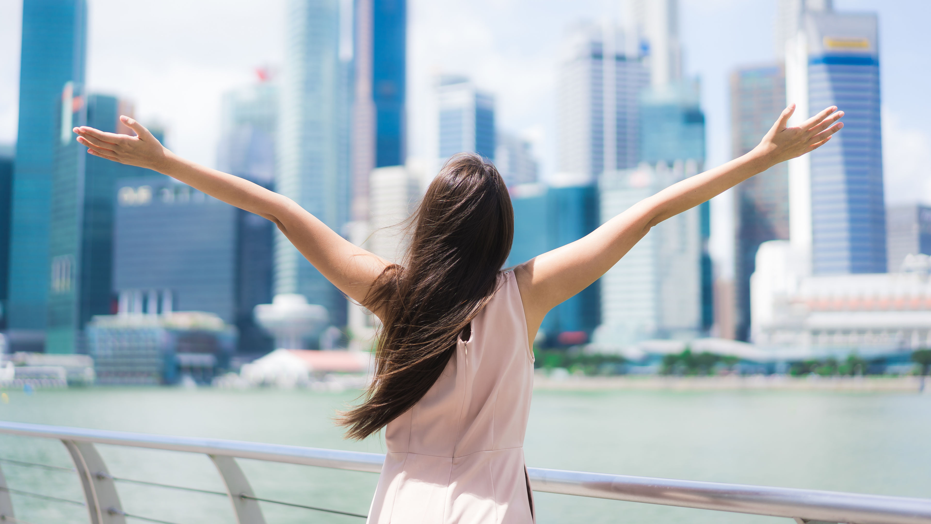 Asian woman happy travelling in Singapore 