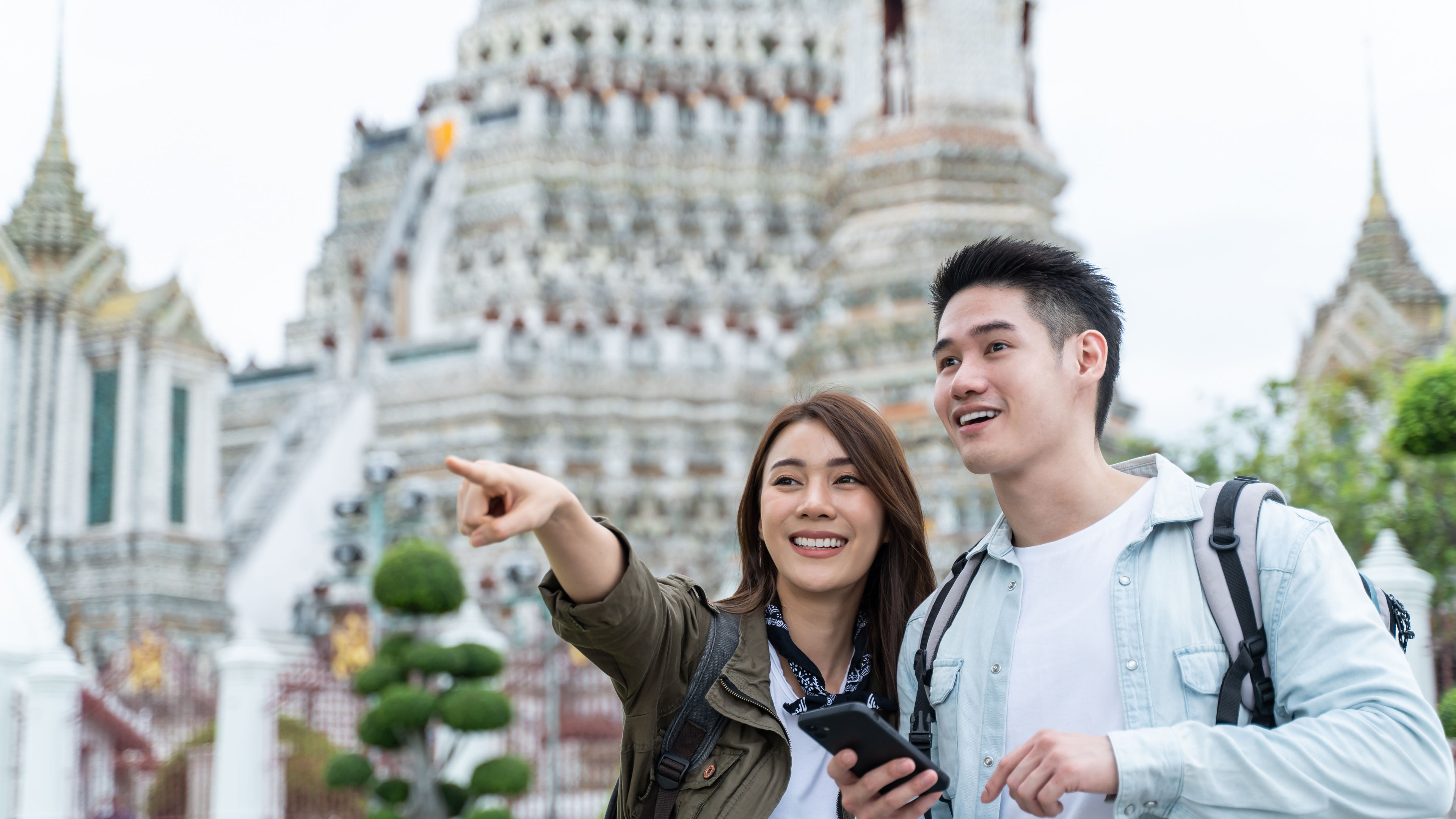 Couple smiling and travelling.