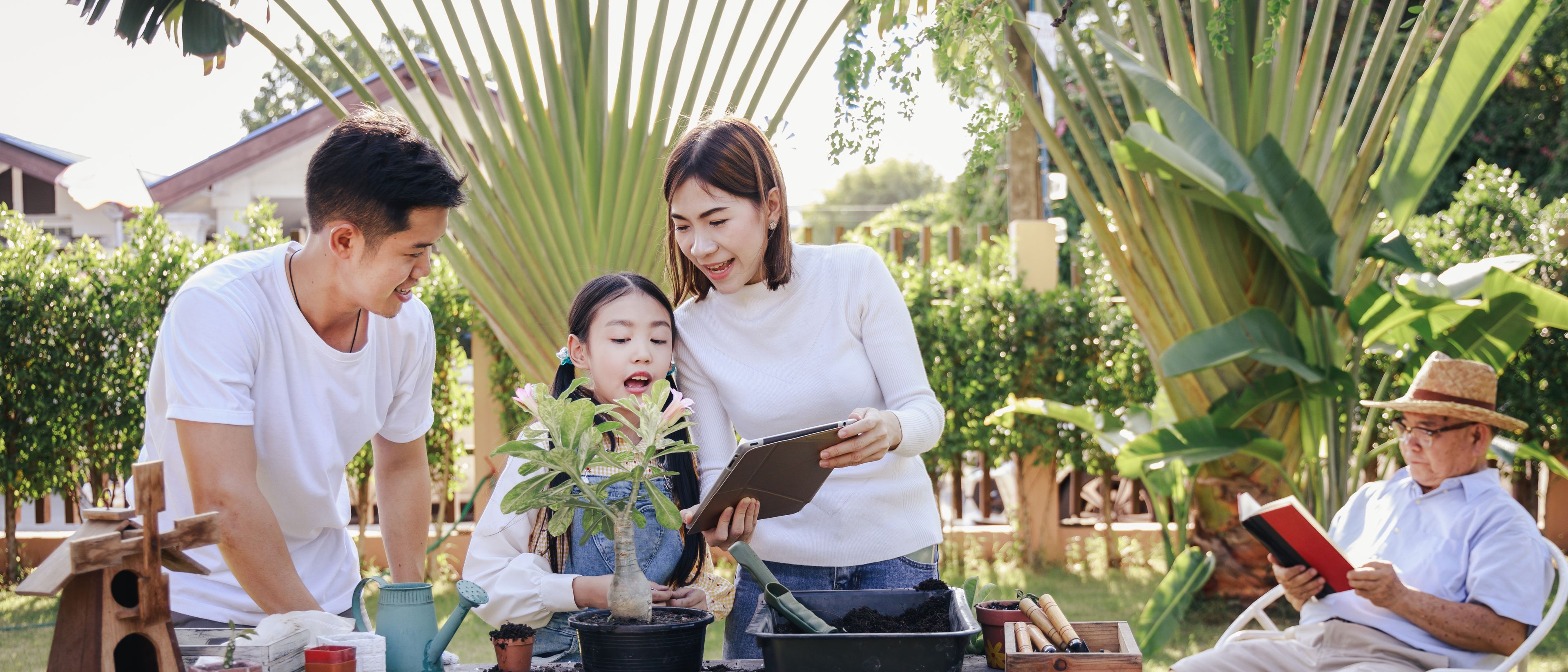 Family planting new plant