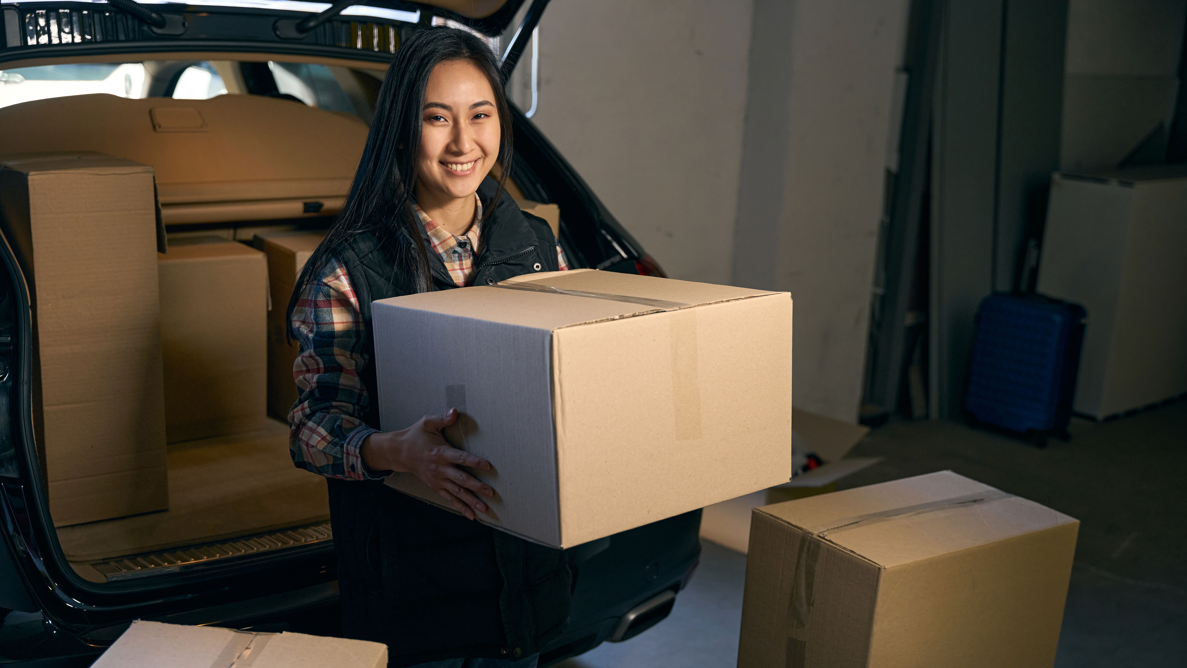 Happy woman with box  