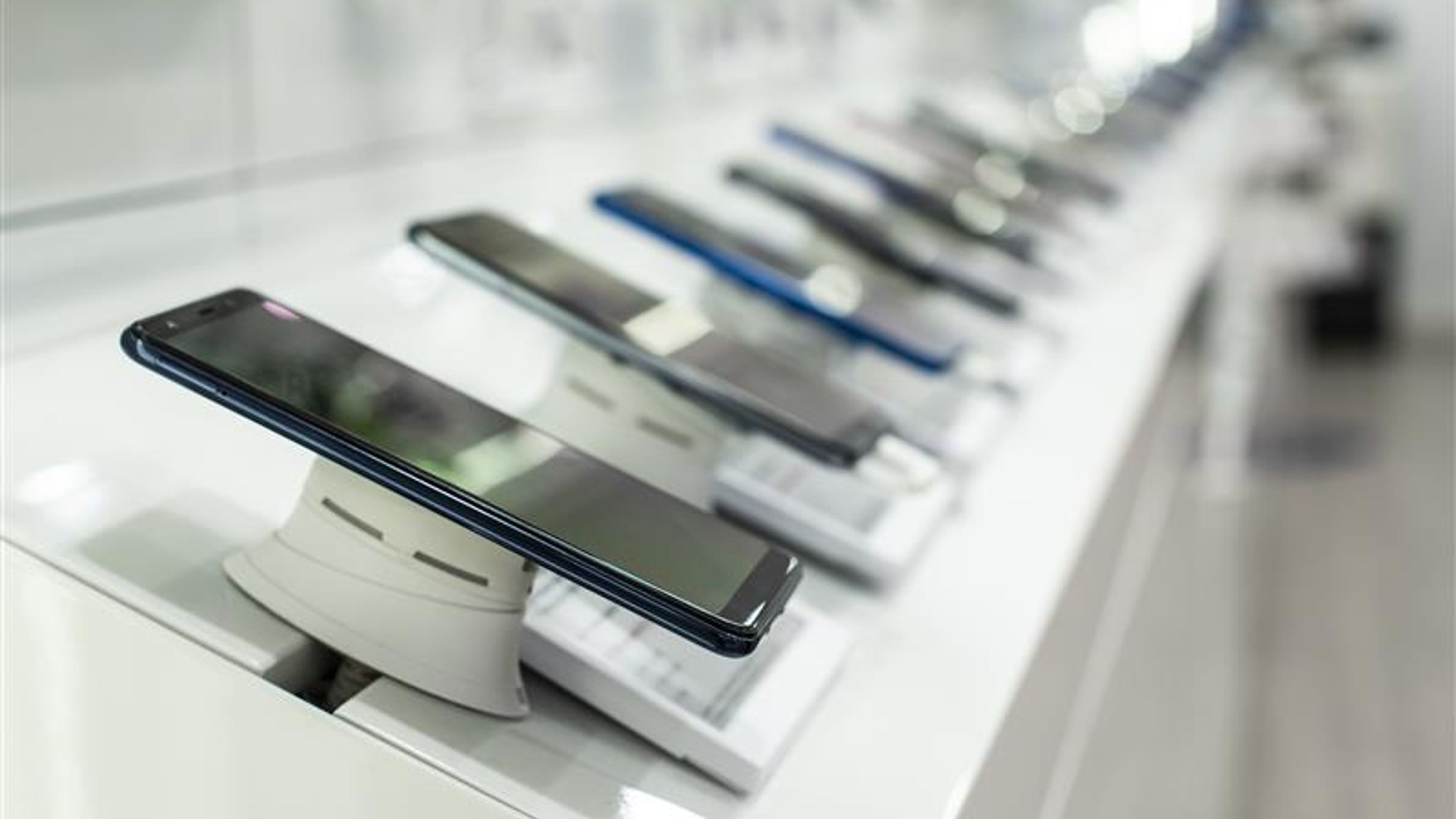 Smartphones on shelf in the store. Concept for communications an