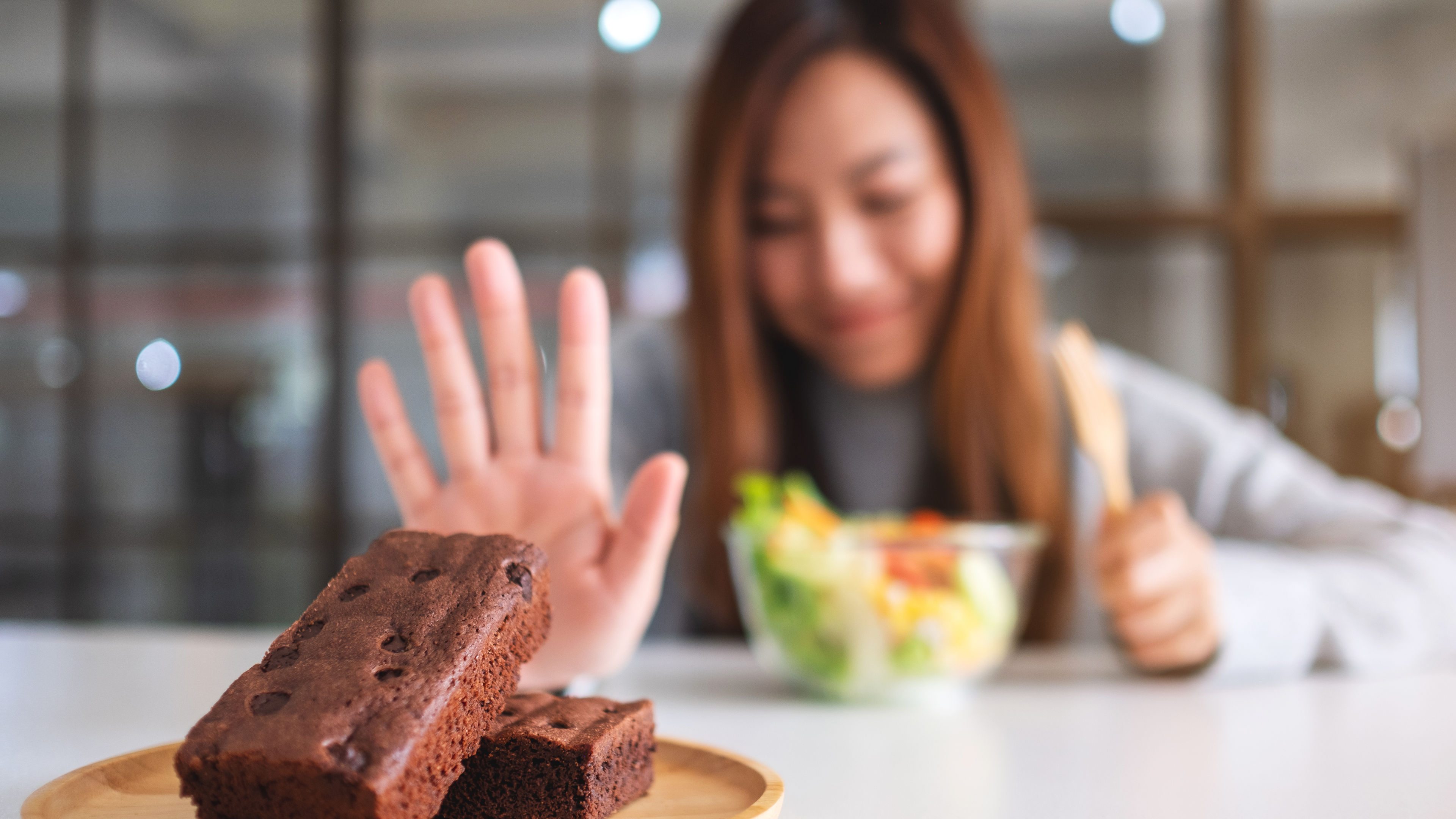 Woman choosing healthy food over packaged food 