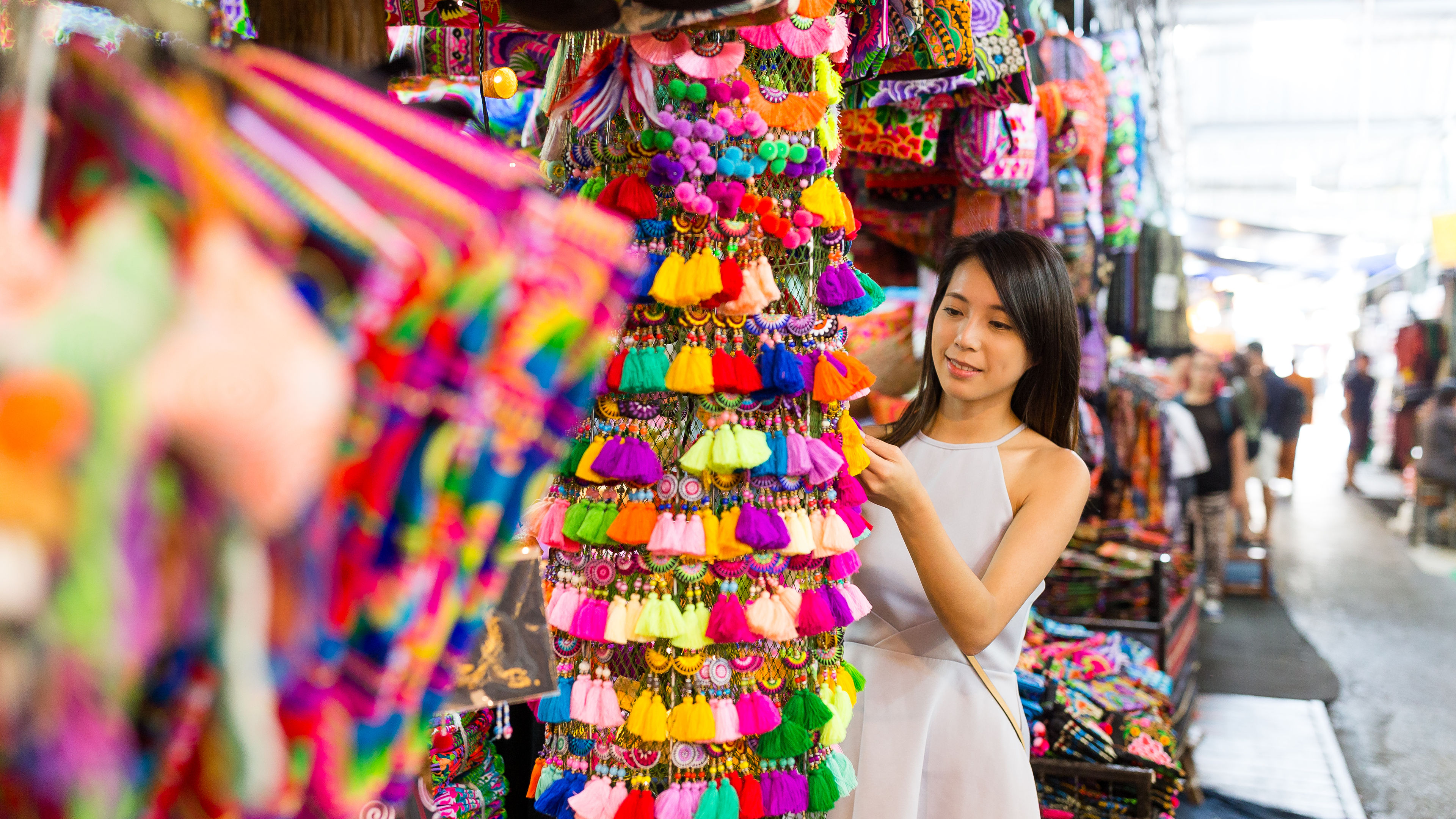 Woman shopping in a street shop in little india 