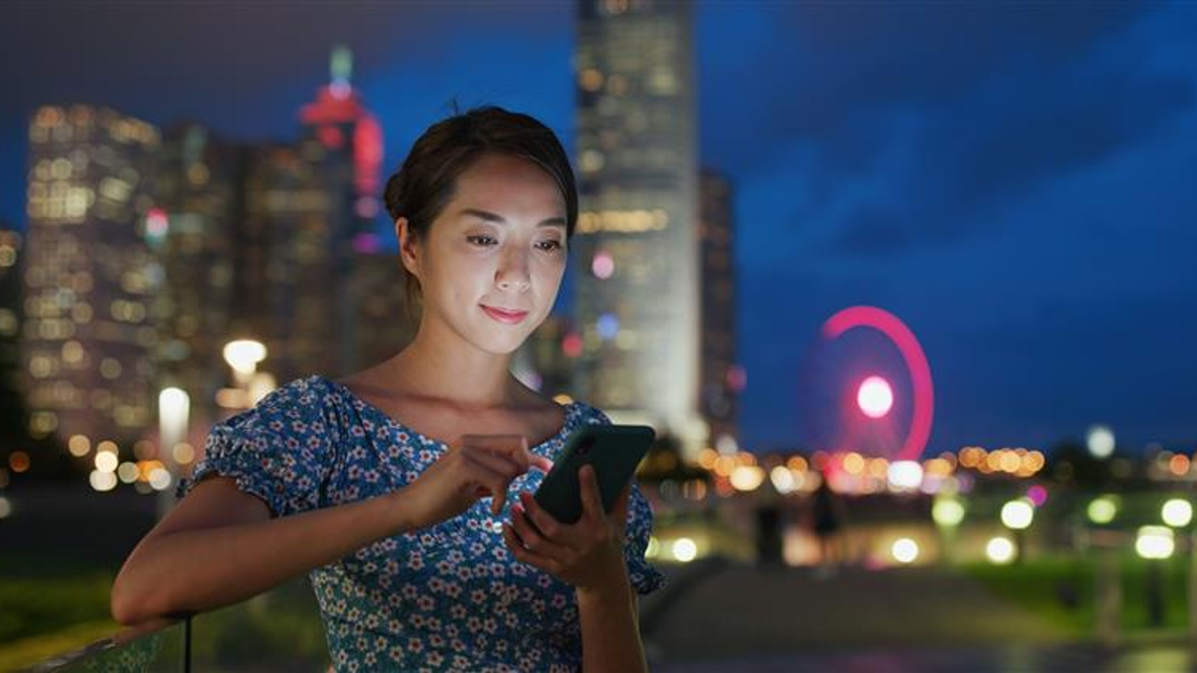Woman use of smart phone at night