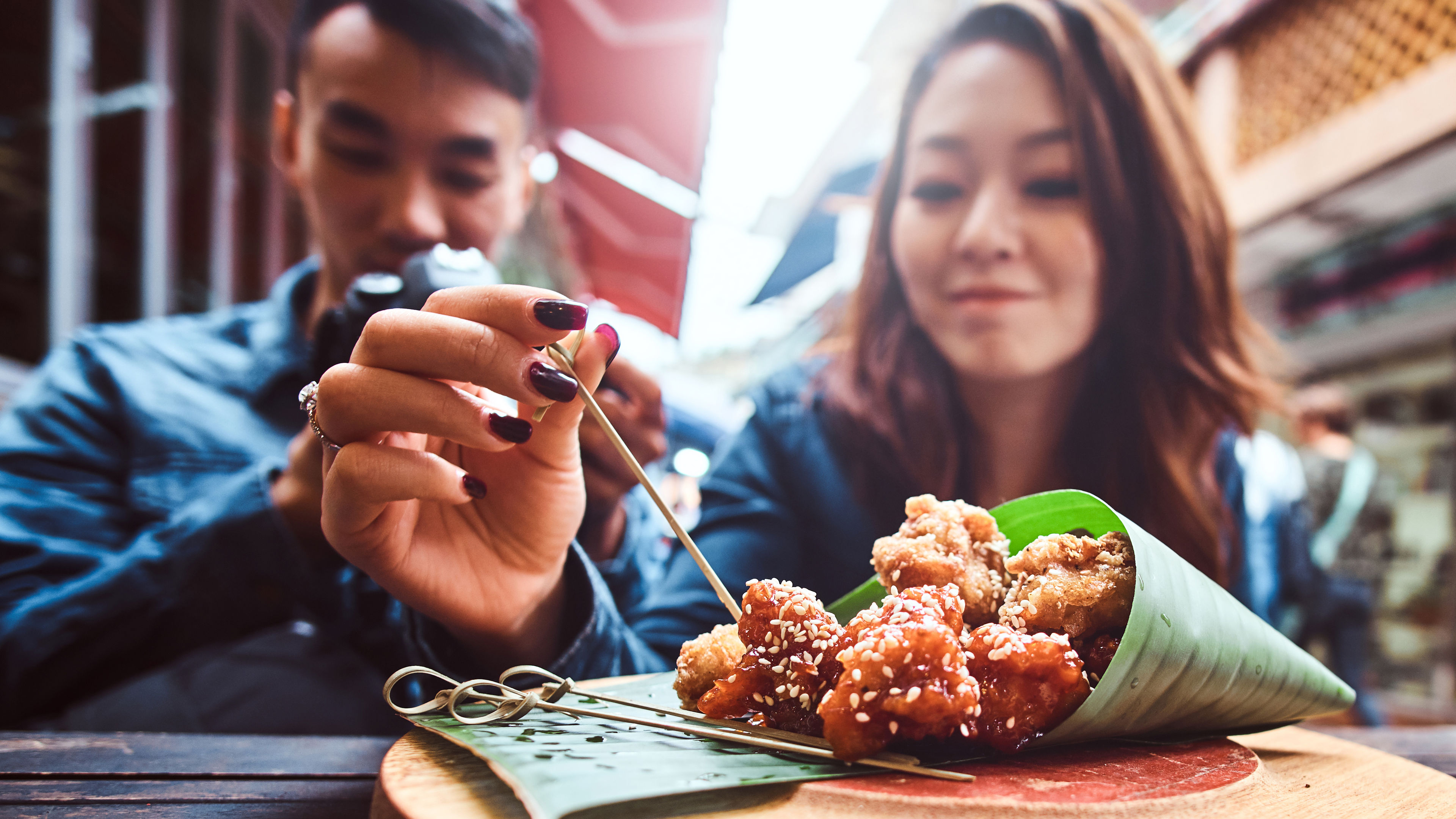 Young couple exploring food in Singapore 